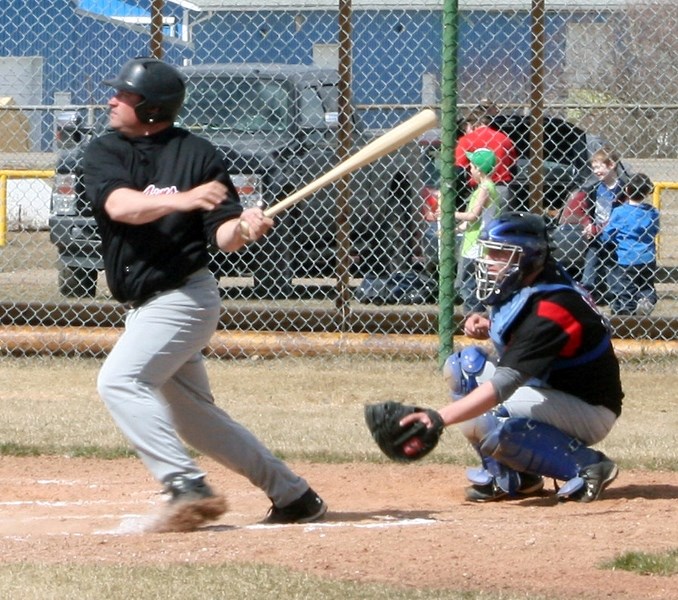 Red Lions’ Kirk Herrick takes a cut during a Saturday afternoon exhibition tilt at Keller Field. The Red Lions rolled to 14-3 win over Stony Plain.