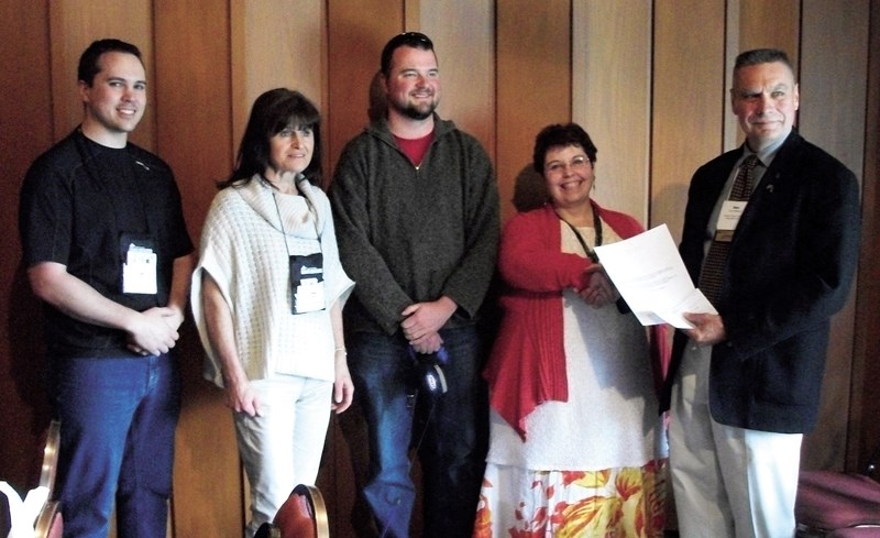 Westlock Library Board members (L-R) Robin Brett, Irene Empey, Doug Neuman and Tanya Pollard receive the Alberta Library Trustees Association Award of Excellence in