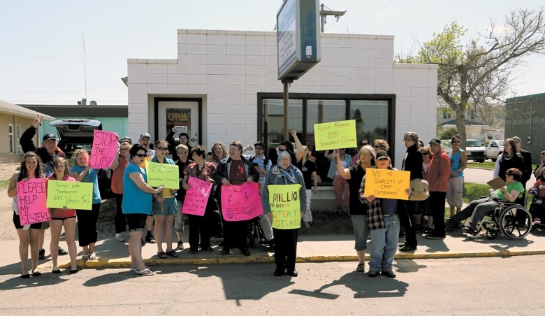 The 40 people protesting in front of MLA Maureen Kubinec’s Westlock office on May 21 to protest the provincial government’s changes to Persons with Developmental Disabilities 