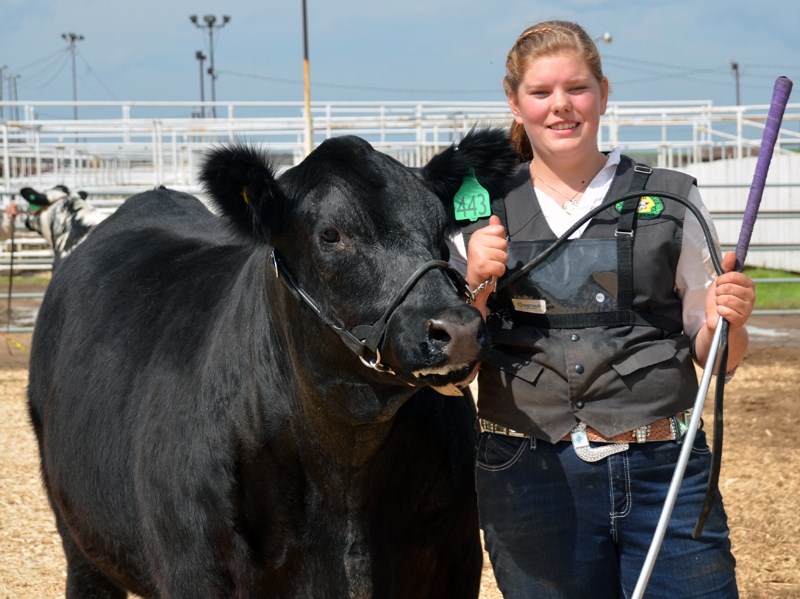 Hanna Gregoire of Sunniebend 4-H Beef with her District Grand Champion Steer, Maverick, at the Westlock District 4-H Achievement Day Show and Sale June 2-3.