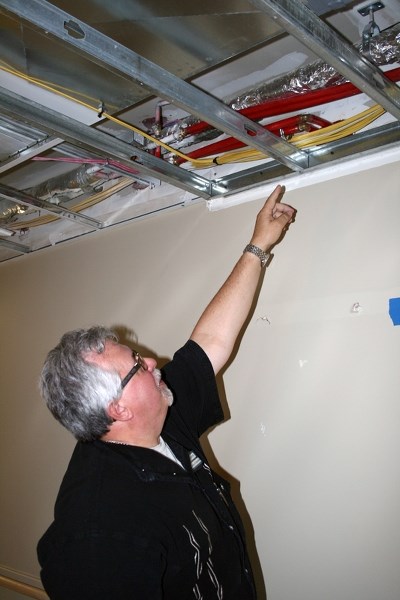 Westlock Foundation’s director of operations, Dennis Lefebvre, points at the pipe that damaged five floors in the west wing of the Pembina Lodge. Lefebvre said the damage was 