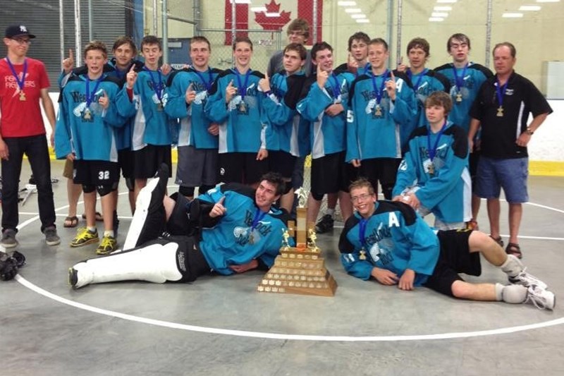 Westlock’s midget Rock celebrate their GELC title last Wednesday. BACK: Bryan Peyre. MIDDLE (L-R): Kevin Peyre (coach), Ryan Craig, Justin Biddiscome, Jeff Fagnan, Keenan