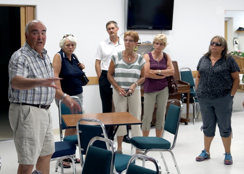 Alberta 55 Plus Summer Games facilities director Chuck Keller (left) shows off the Golden Age Drop-in Centre in Westlock, the site of the contract bridge event. Keller led a