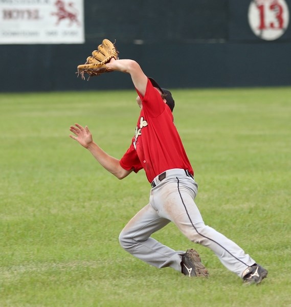 Red Lions shortstop Matt Hutchings dives into left field for a pop-up against the Edmonton Blackhawks on July 10 at Keller Field. The game was rained out in the fourth inning 