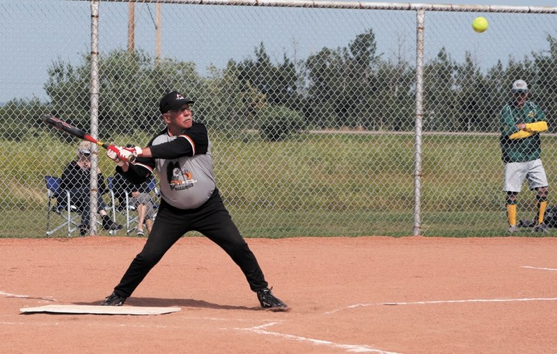 Vimy batter Leo Provencal winds up for a hit in the 65-plus slo-pitch event in Clyde on Friday. Provencal has been playing the sport for more than 25 years.
