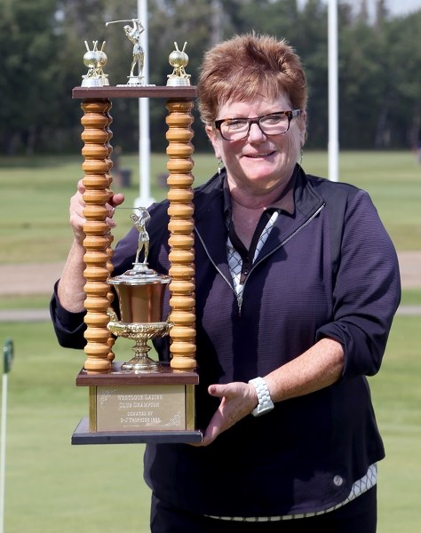 Edmonton’s Elaine Maloney with the Ladies Open championship trophy. Maloney won the two-day tournament by posting a score of 84 on the Barrhead Golf Club on Saturday and a 78 