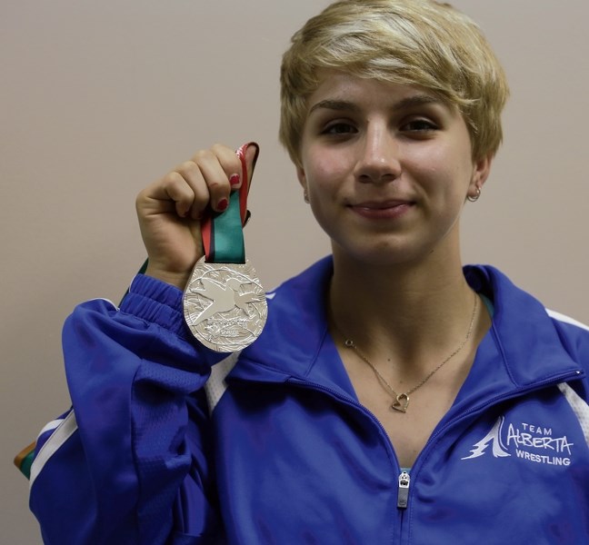 Wrestler Haley Heffel with her team silver medal earned at the Canada Summer Games in Sherbrooke, Que. Aug. 2-8. Heffel left for Serbia on Aug. 19 to compete in the World