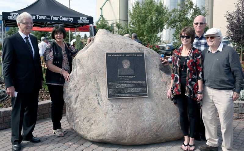 Dr. Georges L. Whissell’s five children (L-R) Georges &#8220;Bookie, &#8221; Marlene, Elaine Chrapko, Brian and Ron stand with their father’s memorial plaque in the newly