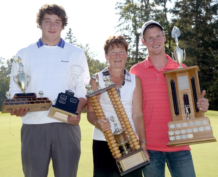 Westlock’s golf champions for 2013, (L-R) Chase Rau (juniors), Debbie Shoemaker (ladies) and Chase Provencal (mens) with their trophies after winning their respective
