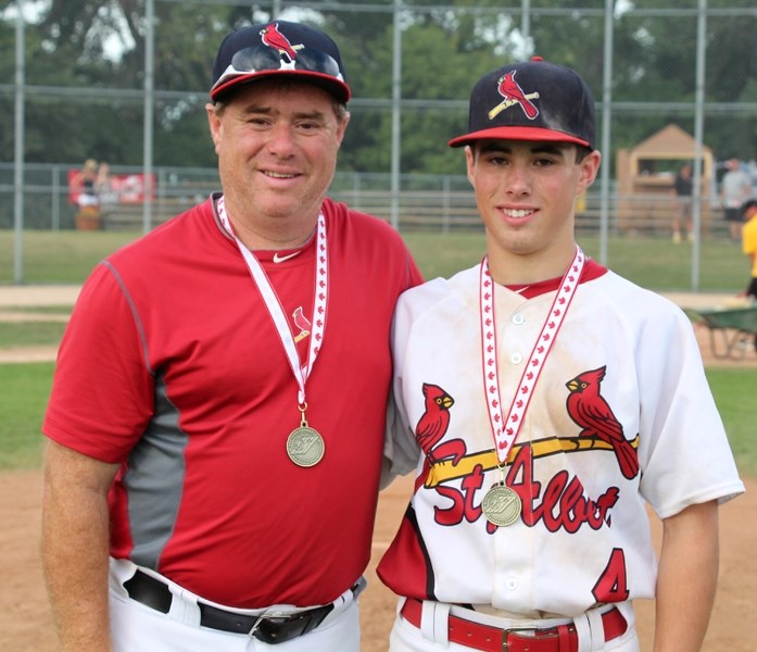 Austin Watamaniuk poses with his dad, Kevin, and his gold medal from the Western Canadian Midget
