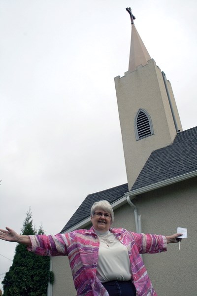 St. Philips Anglican Church Reverend Donna Willer gestures towards an area of the church that will be expanding. The $60,000 expansion includes some changes to the front