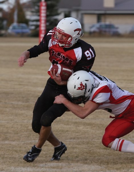 Westlock T-Bird Zach Kiselyk tries to evade a Vermilion Marauder tackler during second-half action at WES on Sept. 27. The T-Birds rolled to a 30-7 win.
