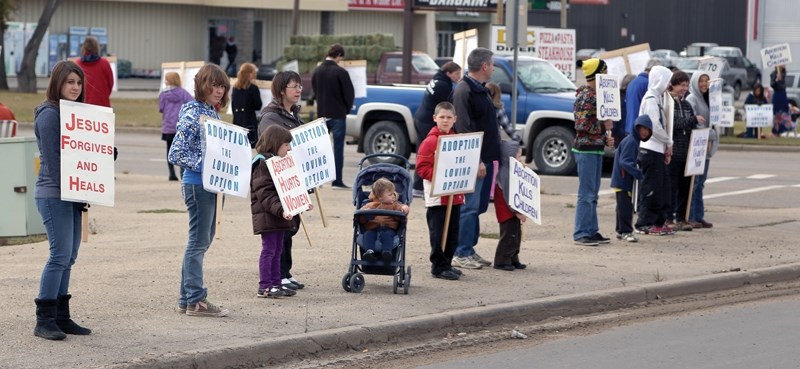 More than 70 men, women and children stood in silent protest against abortion during the Pembina Pro-Life Life Chain last Sunday. Protestors were set up on the corners of