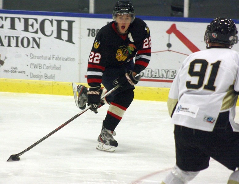 Westlock Warrior Mike Ivey lines up for a shot on Devon’s net during Saturday’s home game. Westlock won 4-2.