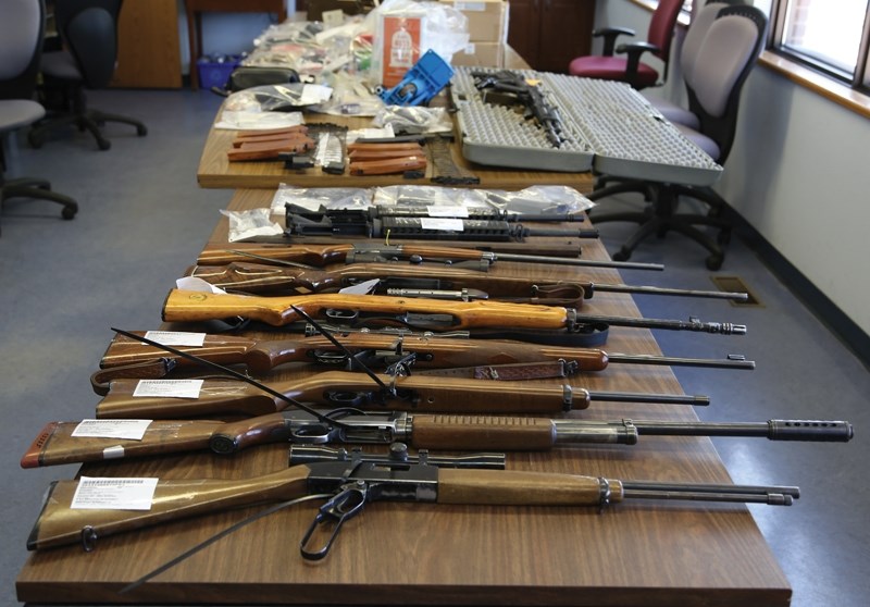 Westlock RCMP seized more than a dozen firearms and thousands of rounds of ammunition from a rural property between Nov. 15-19. Two men face 28 firearms charges each stemming 