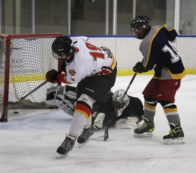 Madison Vekved pots the winning goal into the open Wabamun net with less that two minutes to play Friday night. The goal gave the midget Warriors their first win of the