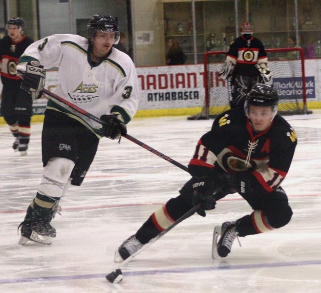 Westlock Warriors Evan Kuhar maintains control of the puck during Friday’s game against the Athabasca Aces in Athabasca. The Warriors scored late in the second en route to a