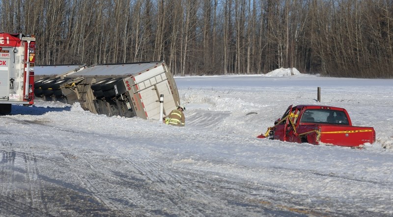 One man is dead following a collision that saw two vehicles blown off Highway 44 near Jarvie on Wednesday afternoon. RCMP report that the driver of the red truck was struck