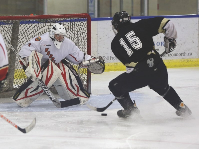 Westlock midget Warriors goalie Dylan Geiger bears down to make a save against Onoway on Jan. 24 at the Westlock Rotary Spirit Centre. The Warriors won the game 6-1 to earn