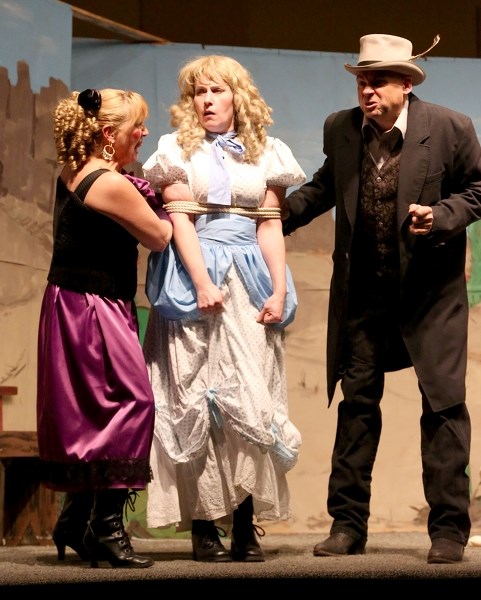 Sue Sandtrappe (left, Terry Steiestol) and brother Nash T. Sandtrappe (Ted Brooks) hold Birdie Dimples (Lynda Pelletier) hostage in order to exhort her aunt out of her