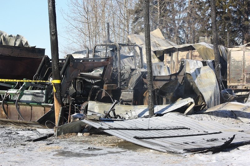 All that’s left of a barn is rubble after a fire that destroyed the structure and several pieces of farm equipment north of Dapp on Feb. 3.