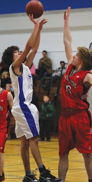 Saint Mary Shark Julien Young takes a jump shot against J.R. Robson in the team’s first game of the W.J. Kallal tournament on Feb. 7.