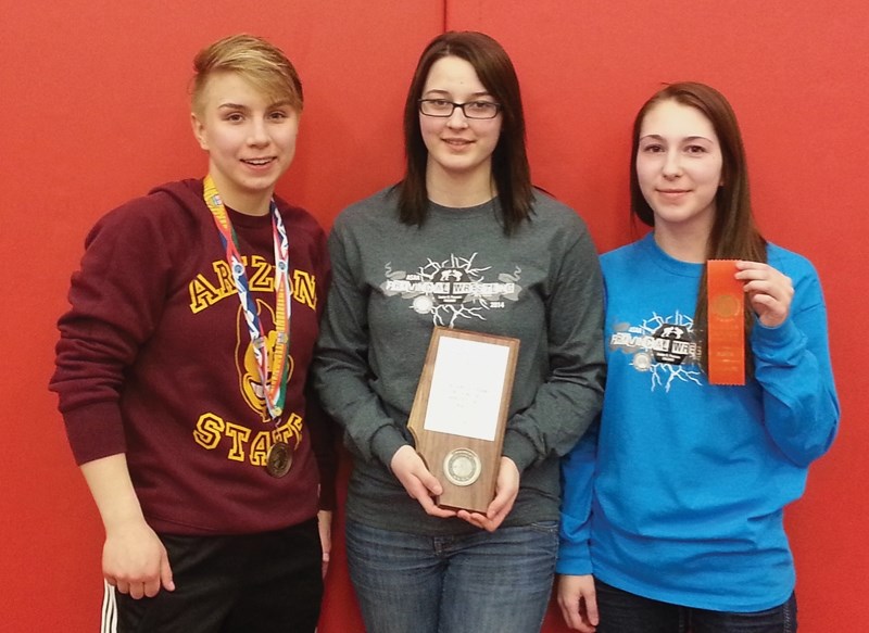 R.F. Staples’ girls’ wrestling team won silver on the strength of Haley Heffel’s (left) gold and Paige Lemmen’s (right) sixth-place finish. The team won a plaque for their
