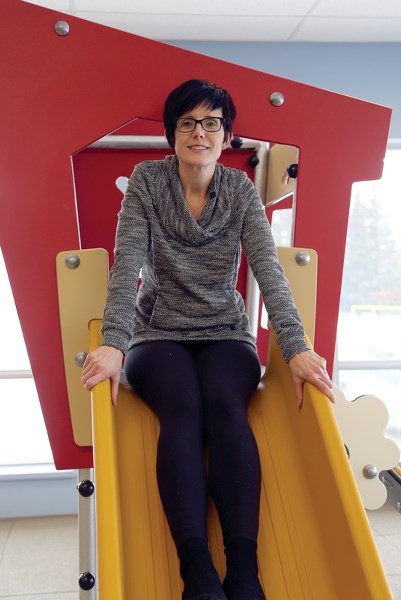 Lisa Boulerice sits on the slide inside Kali’s Korner at the Westlock Rotary Spirit Centre during the grand opening of the child-minding space on Wednesday, March 26. Kali,