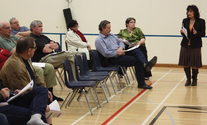 Pembina Hills Supt. Colleen Symyrozum-Watt (right) speaks to the small crowd assembled at W.R. Frose School in Fawcett on April 7 about the proposed closure of the school. A