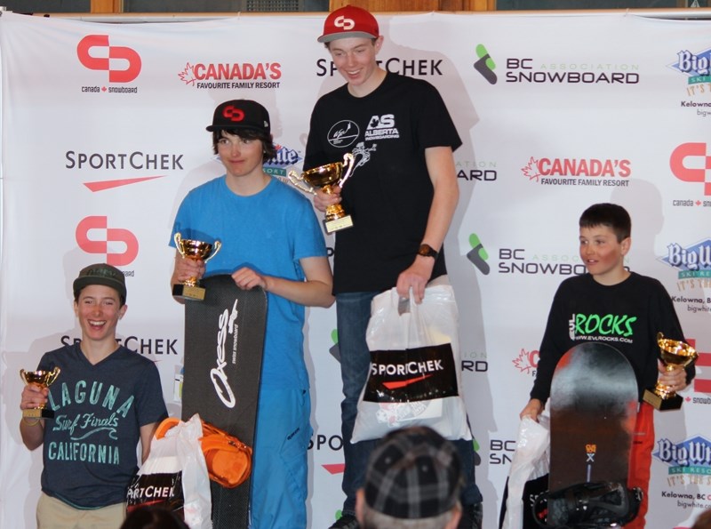 Levi Foster, the 2014 Canadian snowboard cross under-14 champion stands atop the podium following his win at the April 3-6 Canadian Snowboard Cross Championships in Kelowna,