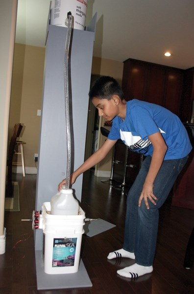 Grade 8 R.F. Staples student Siddhant Gautam demonstrates the hydro-electric generator he built for this year’s science fair competitions. His work earned him a bevy of