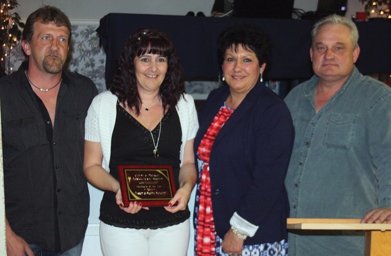 Darren and Shonda Sawchyn (left) were named the 2014 volunteers of the year at the Ag 500 event in Clyde last Saturday evening. Last year’s winners, Brad and Mel Nelson,