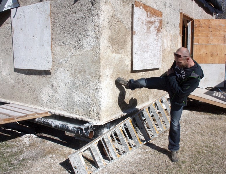 Dion Lefebvre demonstrates the strength and durability of hempcrete with a well-place kick. The Westlock County man is building a house out of the material which he plans to