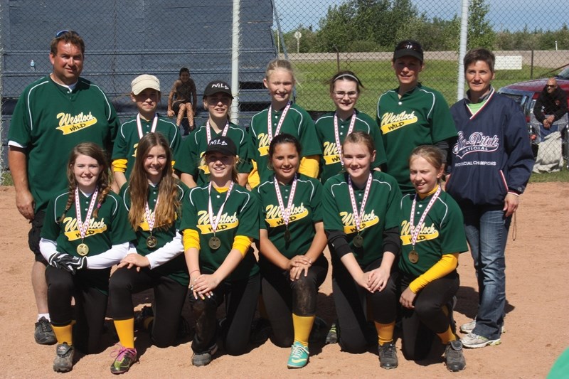 The Wild pose with their league championship medals. In the back row, left to right, are John Guelly, Karis Huppertz, Rachelle Pollard, Kaylee Huppertz, Kristen Guelly,