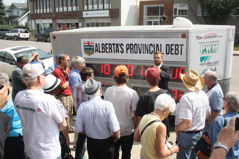 Alberta director of the Canadian Taxpayers Federation Derek Fildebrandt addressed a small crowd in downtown Westlock last Friday afternoon in front of the debt clock, which