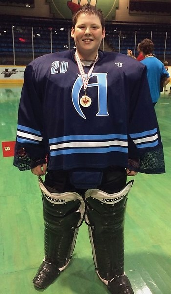 Westlock’s Trace Stewart, 12, proudly displays the bronze medal he won as a part of Team Alberta at the 2014 Lacrosse Nationals which ran Aug. 4-9 in New Westminster and
