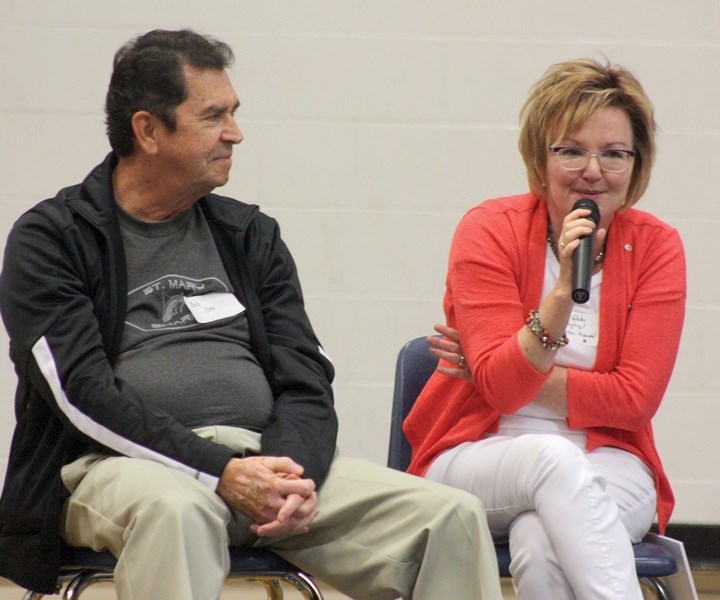 Bob Oko listens while principal Sheila Glebe shares some of her favourite memories of St. Mary School during the 50th anniversary celebration held over the weekend.
