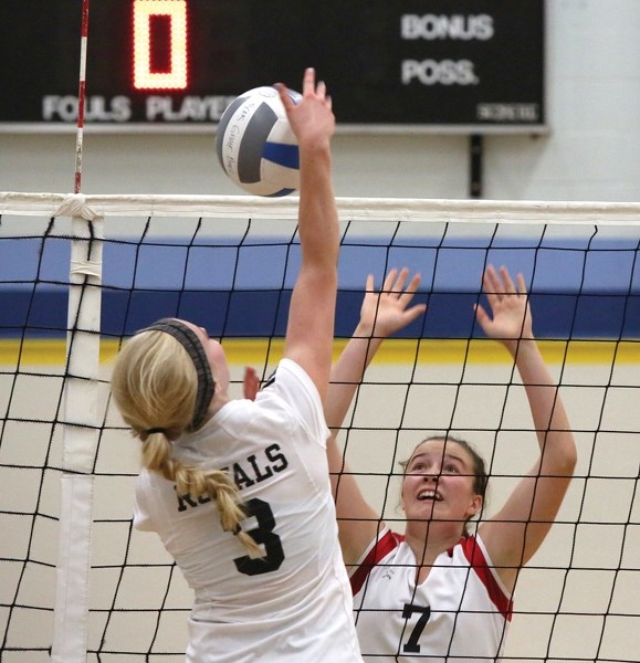 R.F. Staples’ Britannie Ouimet tries valiantly for a block against the Beaverlodge Royals. The spike went out of bounds on the play as the T-Birds won the match.