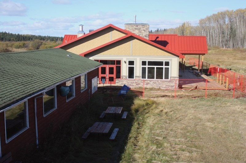 The new Tawatinaw Valley ski chalet looks to be nearly complete, but opening will be delayed because of water-related issues.