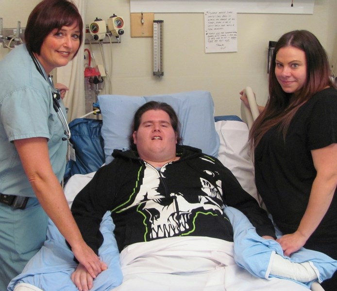 Lance McNamara, pictured here with his wife Ashley and nurse practitioner Kim Scherr, who has worked with him since he was admitted to the Miseracordia Community Hospital