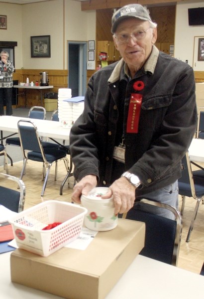 Westlock Legion volunteer Robert Reason gets ready to distribute poppies to Westlock-area businesses as part of the Legion’s annual poppy drive. The annual drive raised close 