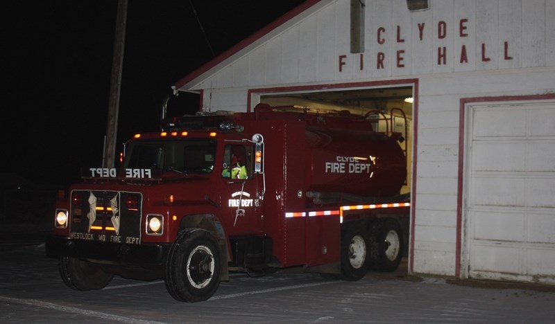 Westlock County’s tender is pictured here leaving the Clyde Fire Hall on Dec. 23. It has been relocated to the Westlock Rural Fire Hall following a disagreement about funding 