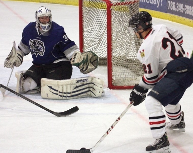 Westlock Senior &#8216;AA&#8217; Warrior Nathan Brown lines up a shot during a 13&#8211;3 Saturday night home win over the Edson Ice.