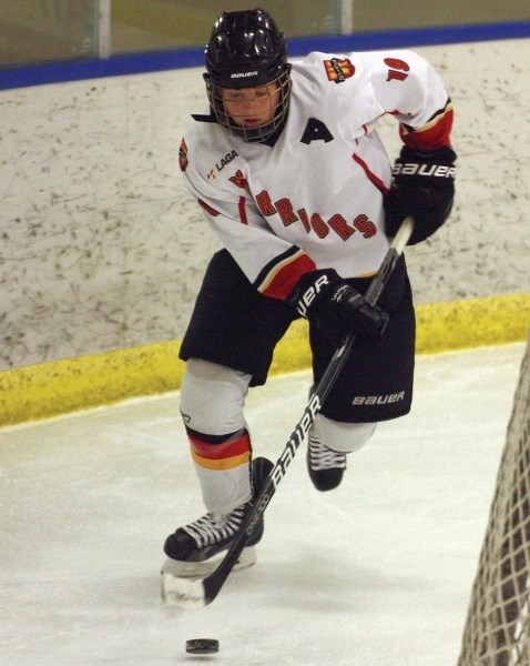Westlock’s Ethan Vekved moves the puck around Fort Saskatchewan’s net during a 6-3 Saturday win.