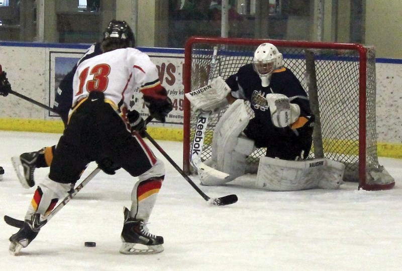 Warrior Ethan Brost shoots on the Edson goalie during a domination stretch of play that saw them score at will. The home side ended up winning Sunday’s game 6-4.