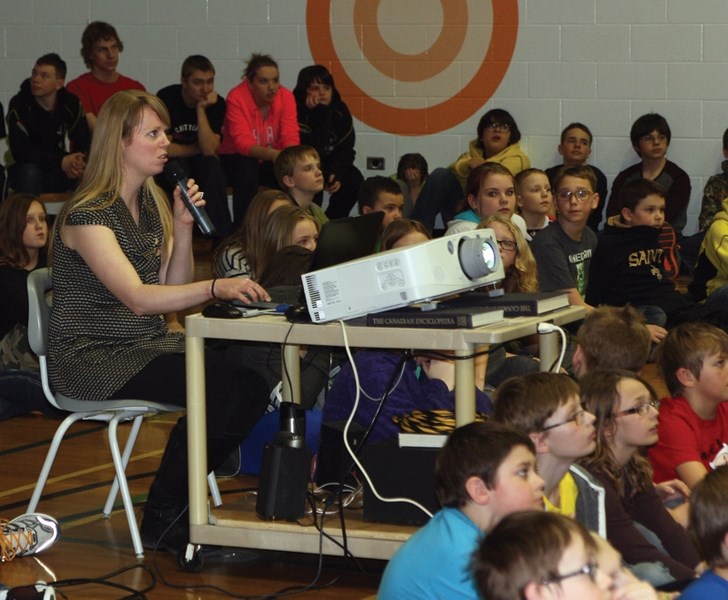 PNCS music/junior high band teacher Kendra Seatter talks about the process of applying for the $10,000 Band-Aid Grant during a student assembly last Thursday afternoon.