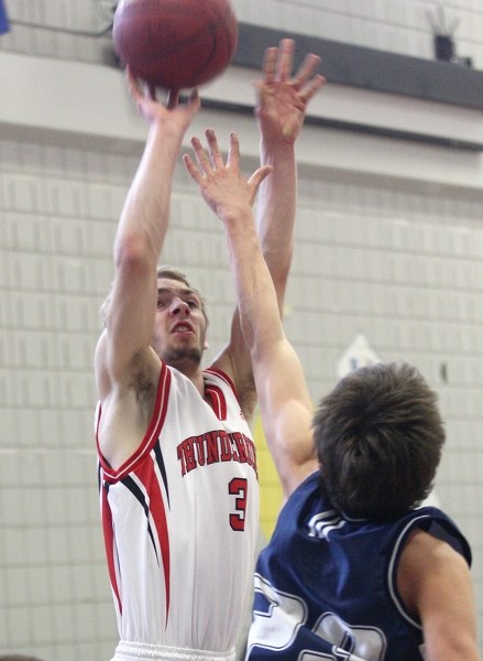 T-Bird Alex Galliford scores over a Parkland Composite High School defender during the club’s 94-90 OT win in the zone consolation final in Morinville March 14.