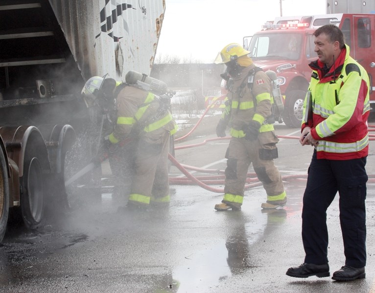 Former Westlock County fire chief John Biro (right) on the scene of a March semi fire. Biro resigned as chief last week.
