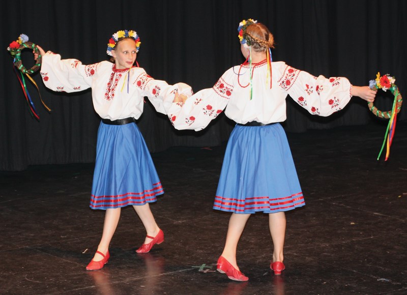 Trinity Chenier and Kassidy Babiak perform a &#8220;wreath duet” during the eighth annual spring concert of the Vrozhay Ukrainian Dancers, which was held on Saturday night at 