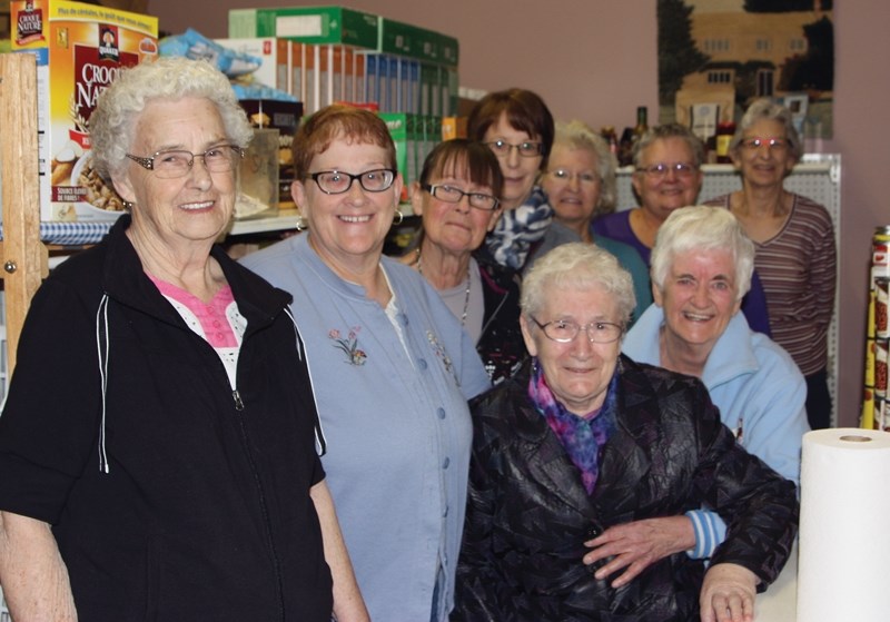 Westlock and District Food Bank board members and volunteers in their humble location at Memorial Hall. Pictured (left to right) secretary Edna Kieser, president Sharon